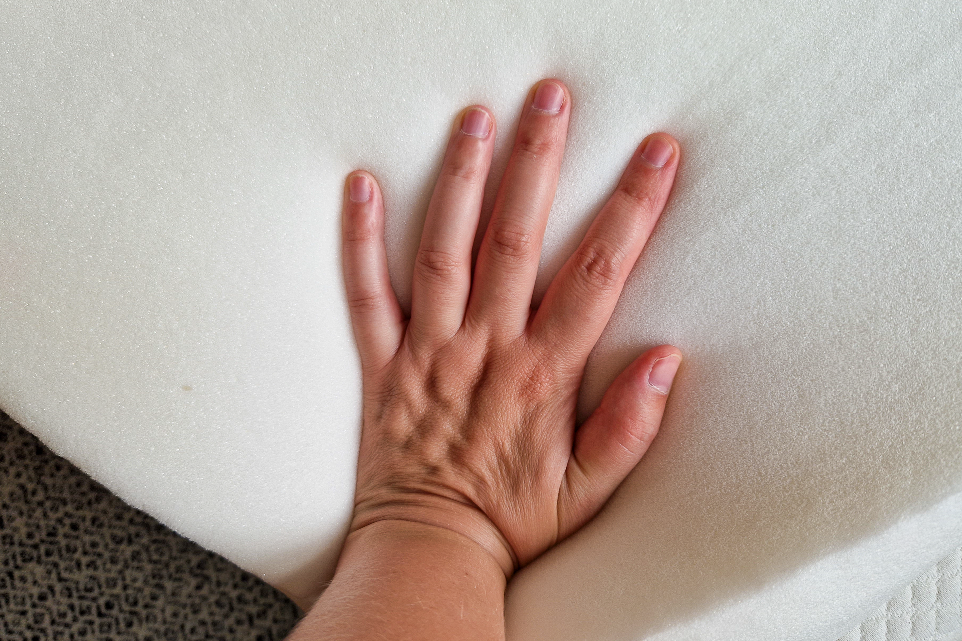 Hypnia mattress topper pressing the foam